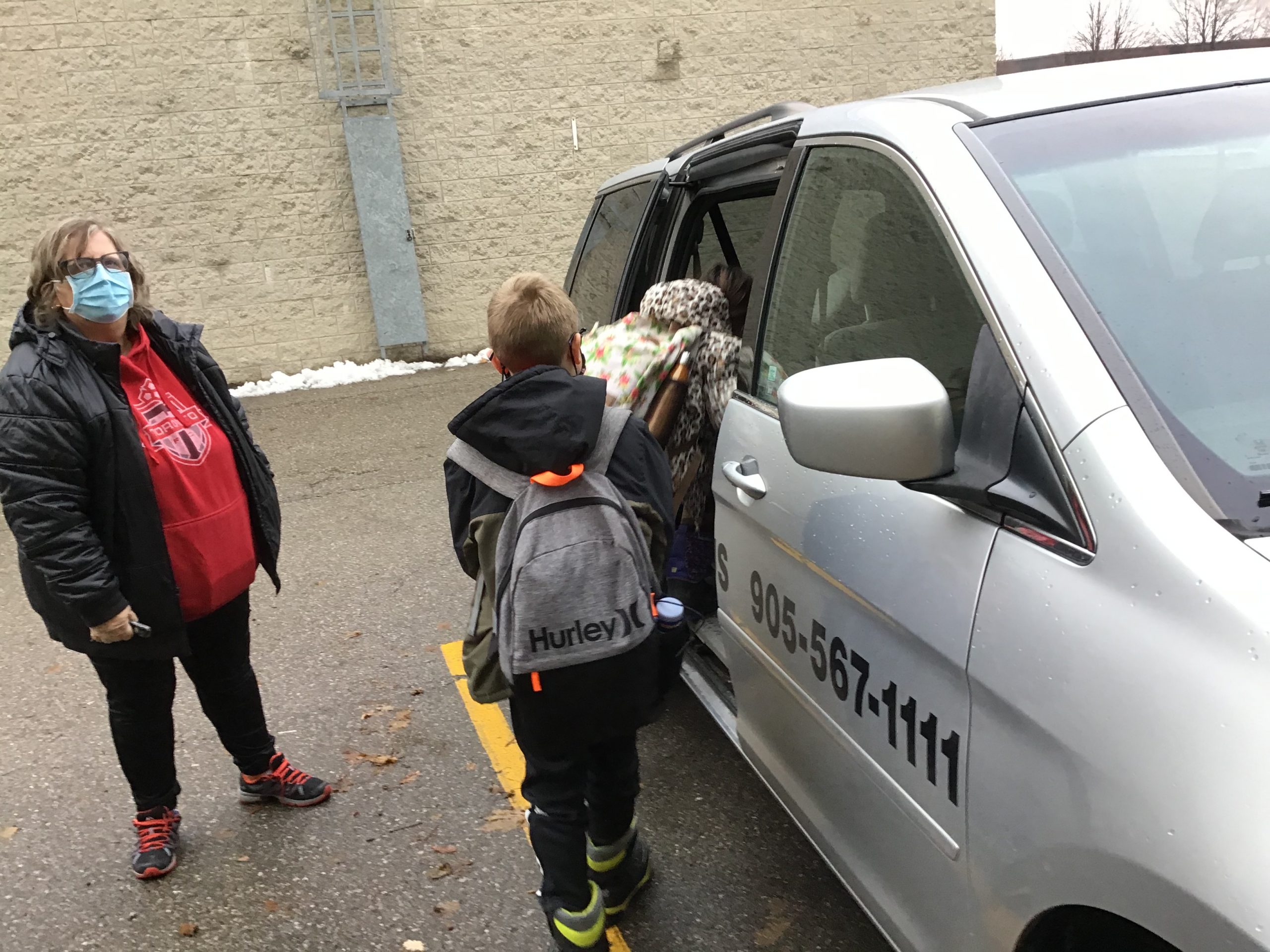Group of kids going into a school van